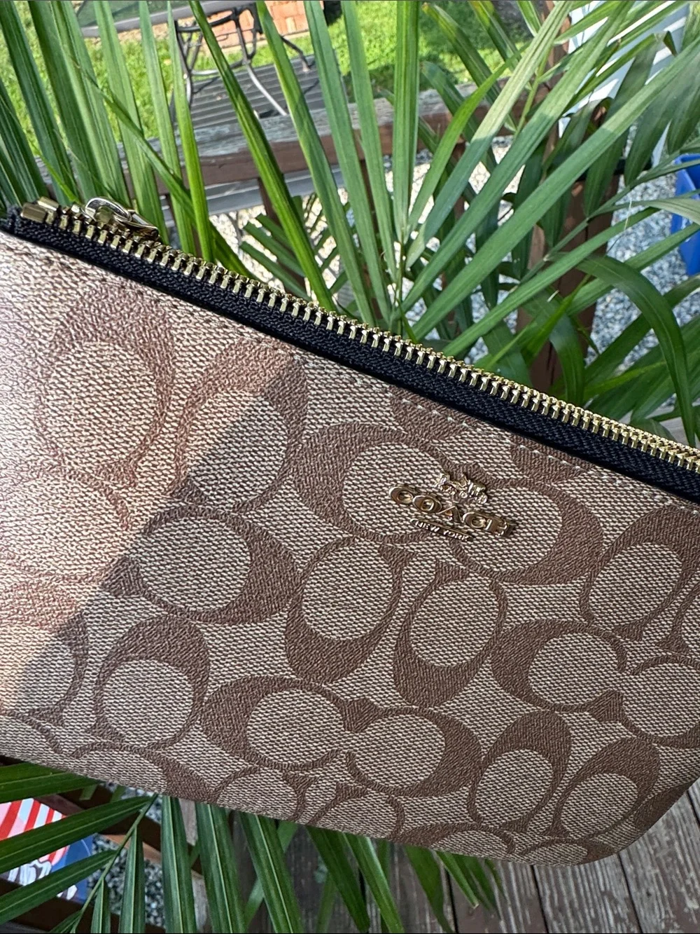 Coach wristlet featuring